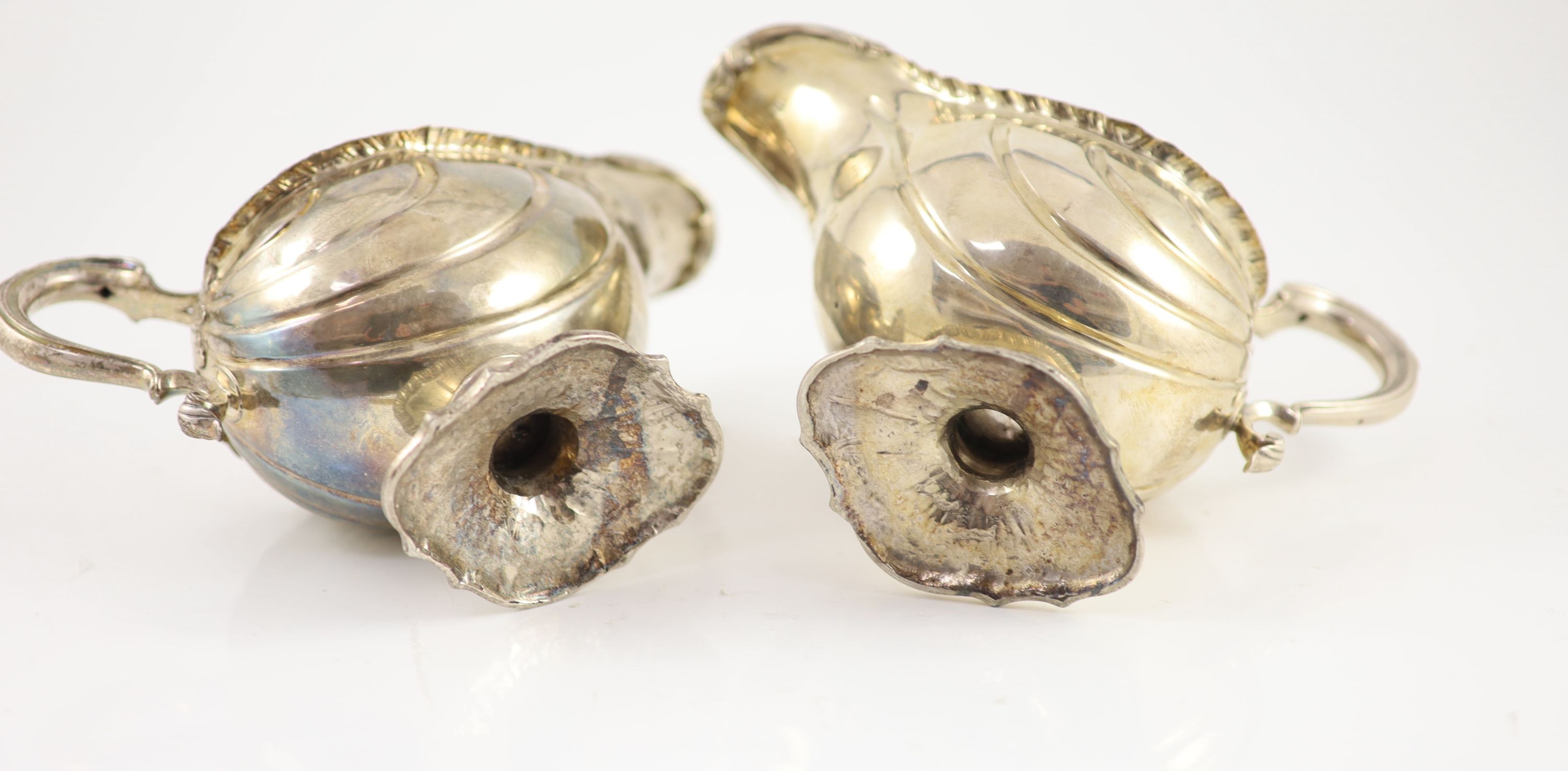 A pair of early George III silver oval pedestal sauce boats by Whyte & Holmes?